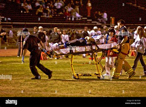 Injured High School Football Player Is Wheeled From The Field By